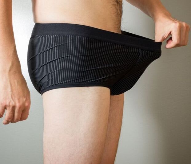 A man looks at his boxers after penis enlargement surgery.